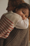 Kamizelka z wełny merino Harvey Kids Sand - Hvid