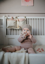 Sensoryczna zabawka press toy - kwiatek Soft Lilac - Mushie